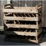 A group of five wooden apple crates.