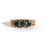 A 9ct gold three-stone sapphire ring, approx UK size 'N'.