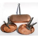 A group of Victorian copper pan lids, the largest 29cms (11.5ins) diameter.