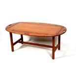 A mid 20th century teak tray top Campaign style two-part coffee table, 120cms (47.25ins) wide.