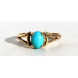 A 9ct gold dress ring set with an oval turquoise cabochon, approx UK size 'N'.