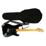 A Korean Squier Stratocaster, serial no. S982555, in a Stagg soft carry bag.