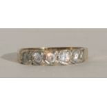 A 9ct gold ring set with five white stones, approx UK size 'Q'.