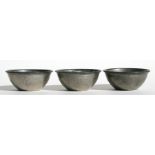 A set of three Liberty & Co. Tudric hammered pewter bowls, numbered 0894, 13cms (5ins) diameter (