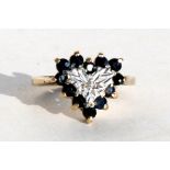 A 9ct gold diamond and sapphire heart shaped dress ring, approx UK size 'O'.
