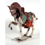 A Chinese Tang style pottery model of a horse, 47cm (18.5ins) high.