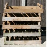 A group of five wooden apple crates.