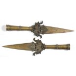 A pair of Indian temple spear heads decorated with peacocks, 46cms (18ins) long.