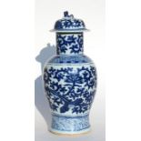 A Chinese blue & white vase and cover with fo dog finial, decorated with foliate scrolls, 46cms (