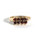 A 9ct gold garnet dress ring, approx UK size 'M'.