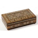 A Damascus ware inlaid musical jewellery box, 25cm (9.75ins) wide.