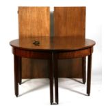 A Georgian mahogany 'D' end dining table with two extra leaves, on square legs, 224 by 121cms (88 by