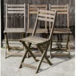 A set of four folding teak garden chairs (4).