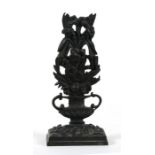 A Regency bronze desk top letter rack in the form of a vase with flowers, 18cms (7ins) high.