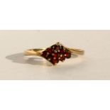A 9ct gold garnet cluster ring, approx UK size 'O'.