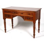 A Victorian mahogany kneehole writing table with two frieze drawers with two drawers underneath,