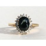 A 9ct gold sapphire and diamond cluster ring, approx UK size 'N'.