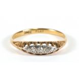 An 18ct gold five-stone diamond ring, approx UK size 'P'.