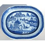 An 18th century Chinese blue & white rectangular plate decorated with a river scene, 28cms (7ins)