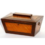 A Regency rosewood and satinwood sarcophagus shaped tea caddy with three interior divisions,