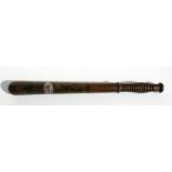 A turned mahogany truncheon with painted decoration, 46cm (18ins) long.