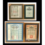 A group of four Chinese Government Bond certificates, framed & glazed, the largest 43 by 49cms (17
