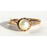 A 9ct gold ring set with a central pearl, approx UK size 'J'.