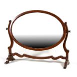A 19th century mahogany oval toilet mirror, 57cms (22.5ins) wide.