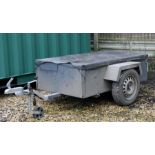 A 5ft by 3ft two-wheeled box trailer and covers.