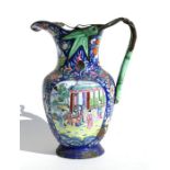 An 18th / 19th century Chinese enamel jug decorated with figures within panels and foliate