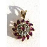 A 9ct gold ruby & diamond pendant.