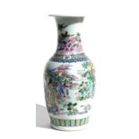 A Chinese famille rose vase decorated with figures within a landscape, blue six-character mark to