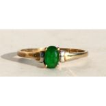 A 9ct gold emerald ring, approx UK size 'N'.
