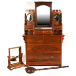 A walnut dressing chest with mirrored top section, with four short jewellery drawers above two short