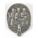 A WWII German Nazi badge - 1935 TAG DER ARBEIT - DAY OF THE WORKER-MAKER - the front has an eagle, a