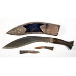 A Gurkha's kukri with horn handle, the scabbard with pierced white metal decoration, 37cms (14.5ins)