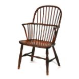 An early 19th century yew and elm Windsor armchair, possibly West Country.Condition Report Splits to