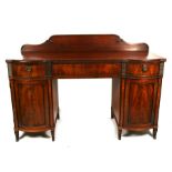 An Edwardian Regency revival figured mahogany twin pedestal sideboard, 168cm (68ins) wide.