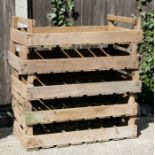 A group of five wooden apple crates.