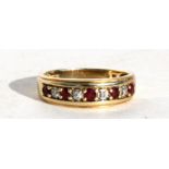 A 9ct gold ruby & diamond half eternity ring, approx UK size 'N'.