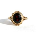 A 9ct gold garnet dress ring, approx UK size 'M'.