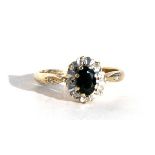 A 9ct gold diamond and sapphire cluster ring, approx UK size 'N'.