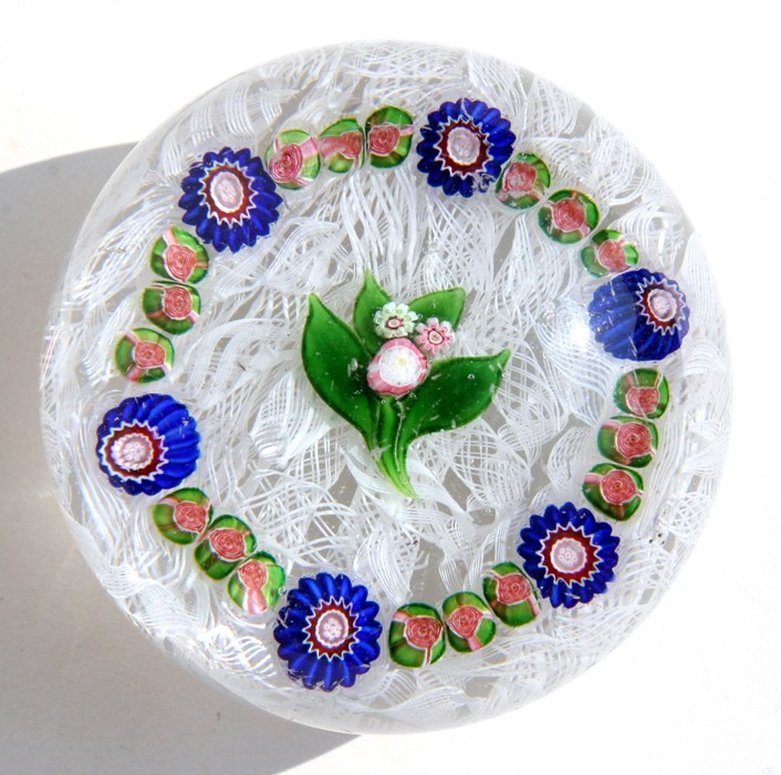 A 19th century French paperweight, possibly Clichy, decorated with central flowers and millefiori