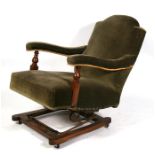 A Howard style upholstered rocking chair.