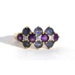 A 9ct gold dress ring set with diamonds and amethyst coloured stones, approx UK size 'T'.