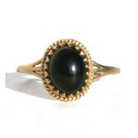 A 9ct gold dress ring set with a large oval cabochon, approx UK size 'U'.