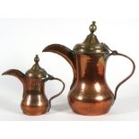 A large copper and brass Turkish / Islamic dallah coffee pot, 34cms (13.5ins) high; together with