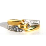 An 18ct two tone gold diamond set ring, approx UK size 'M'.