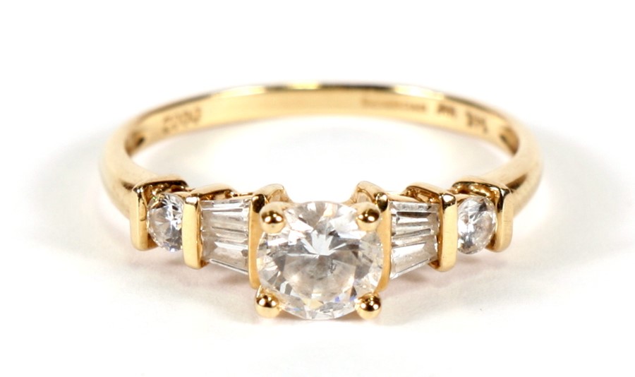 A 14ct gold dress ring set with various cut white stones, approx UK size 'U'.