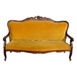 A Victorian mahogany open armed sofa with upholstered seat and back